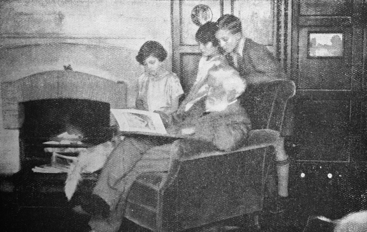 Children and grandfather reading